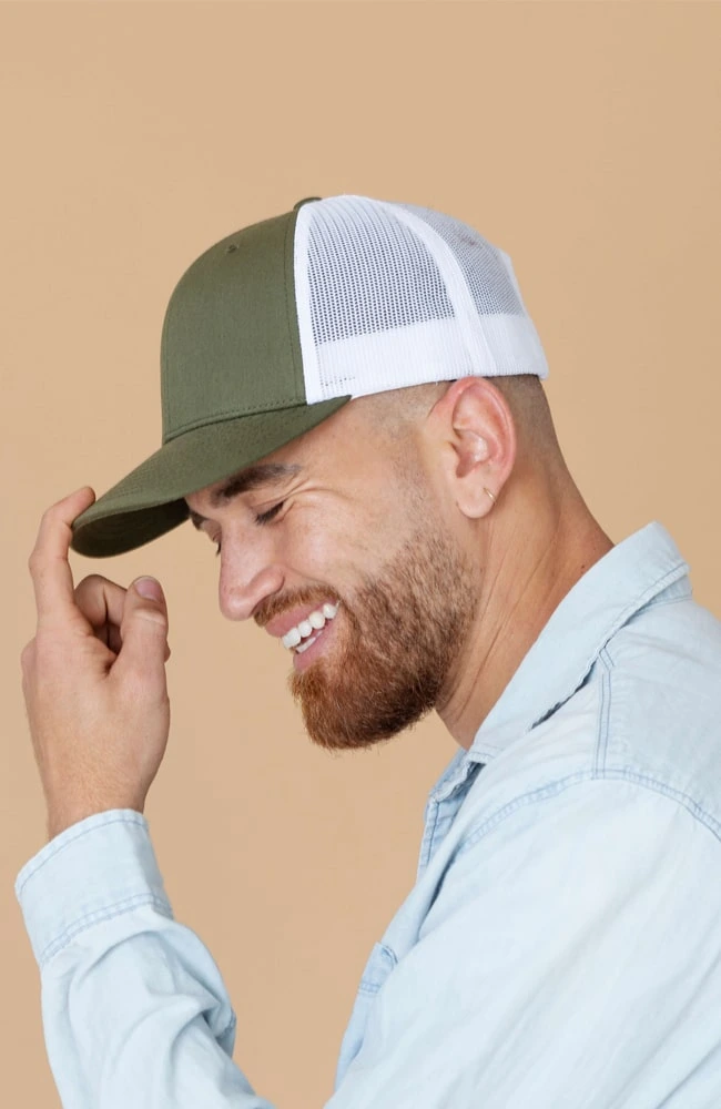 Trucker cap main banner image. Man Wearing a Olive and White trucker cap with mesh